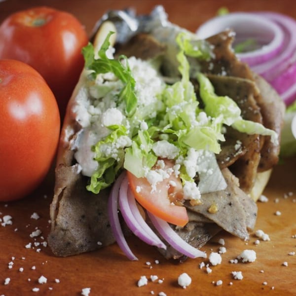 Can Am Pizza's gyro with meat, lettuce, feta, tomatoes, red onions, and sauce.