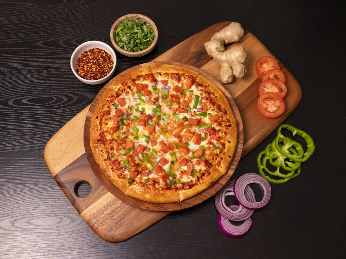 Halal Butter Chicken Pizza.